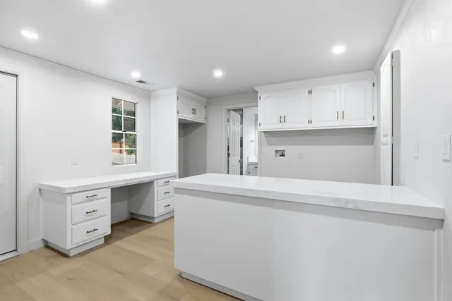 a bathroom with a shower and sink