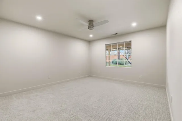 a blue sign that is sitting in front of a house