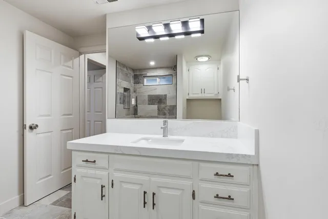 a view of a backyard with large tree