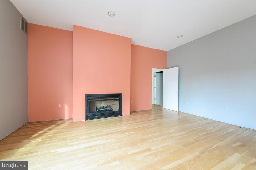 6613 Persimmon Tree Road Cabin John, MD 20818 - Photo 12 of 23 a view of an empty room with a fireplace