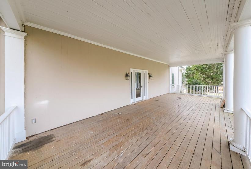 6613 Persimmon Tree Road Cabin John, MD 20818 - Photo 23 of 23 a view of empty room with wooden floor and fan
