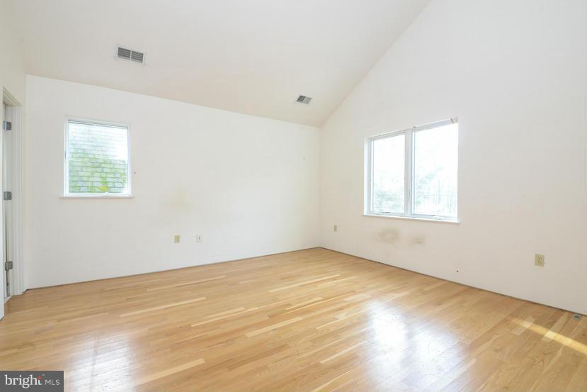 6613 Persimmon Tree Road Cabin John, MD 20818 - Photo 4 of 23 an empty room with a window