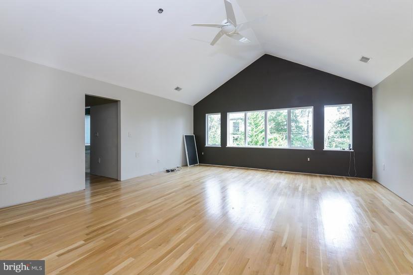 6613 Persimmon Tree Road Cabin John, MD 20818 - Photo 8 of 23 wooden floor in an empty room with a window