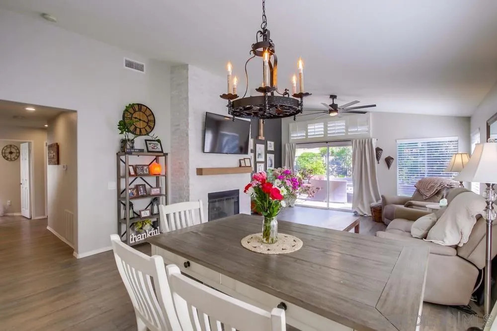 1966 Verbena Terrace Alpine, CA 91901 - Photo 11 of 41 a view of a dining room and livingroom with furniture wooden floor a chandelier