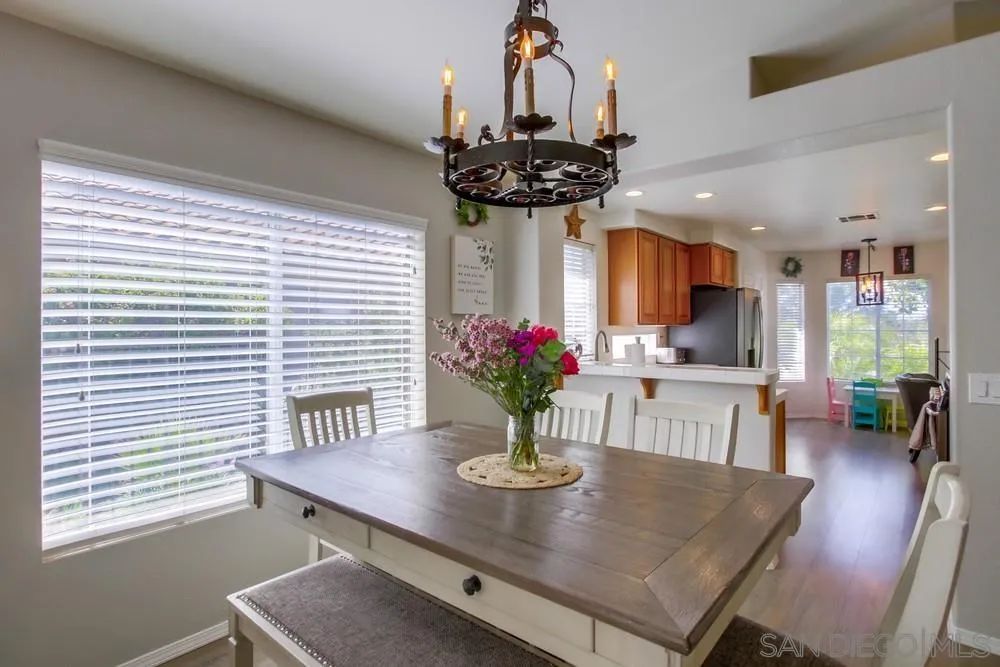 1966 Verbena Terrace Alpine, CA 91901 - Photo 12 of 41 a view of a dining room with furniture and wooden floor