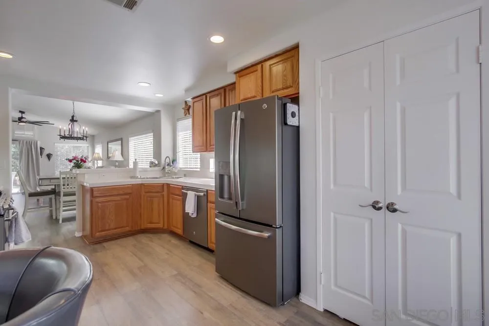 1966 Verbena Terrace Alpine, CA 91901 - Photo 15 of 41 a kitchen with stainless steel appliances refrigerator and microwave