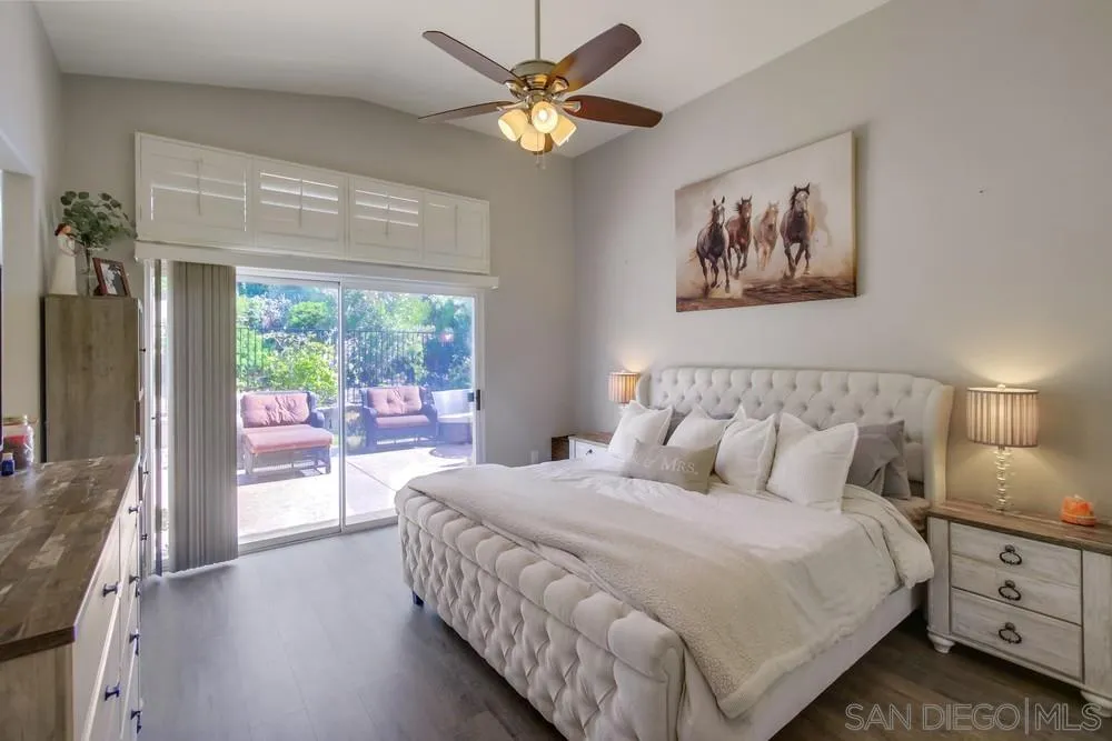 1966 Verbena Terrace Alpine, CA 91901 - Photo 18 of 41 a bedroom with a balcony a bed and a chandelier