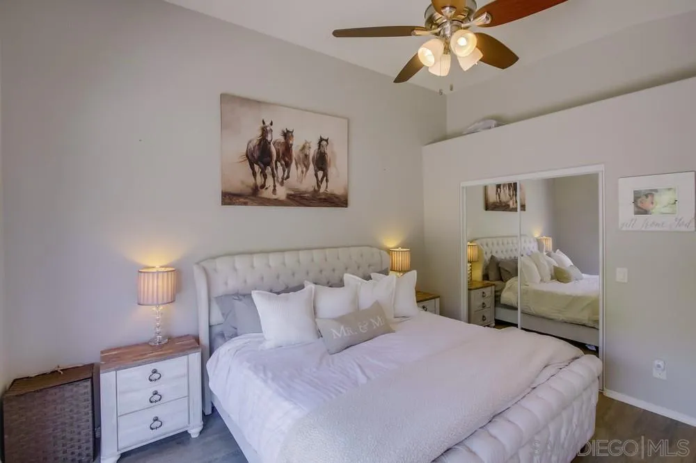 1966 Verbena Terrace Alpine, CA 91901 - Photo 20 of 41 a bedroom with a bed and a chandelier