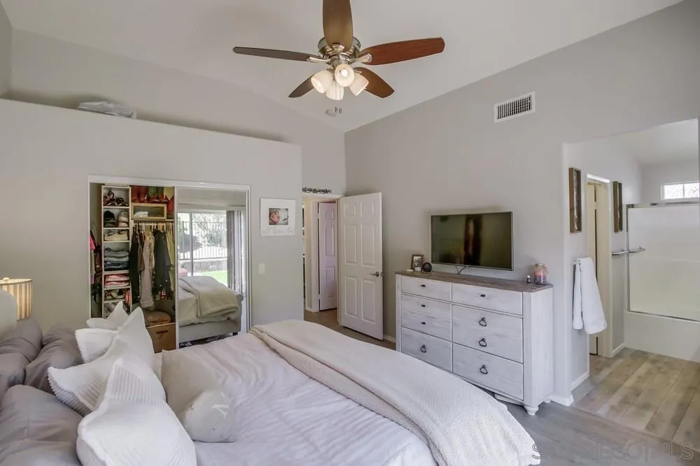 1966 Verbena Terrace Alpine, CA 91901 - Photo 21 of 41 a bedroom with a bed and a flat screen tv