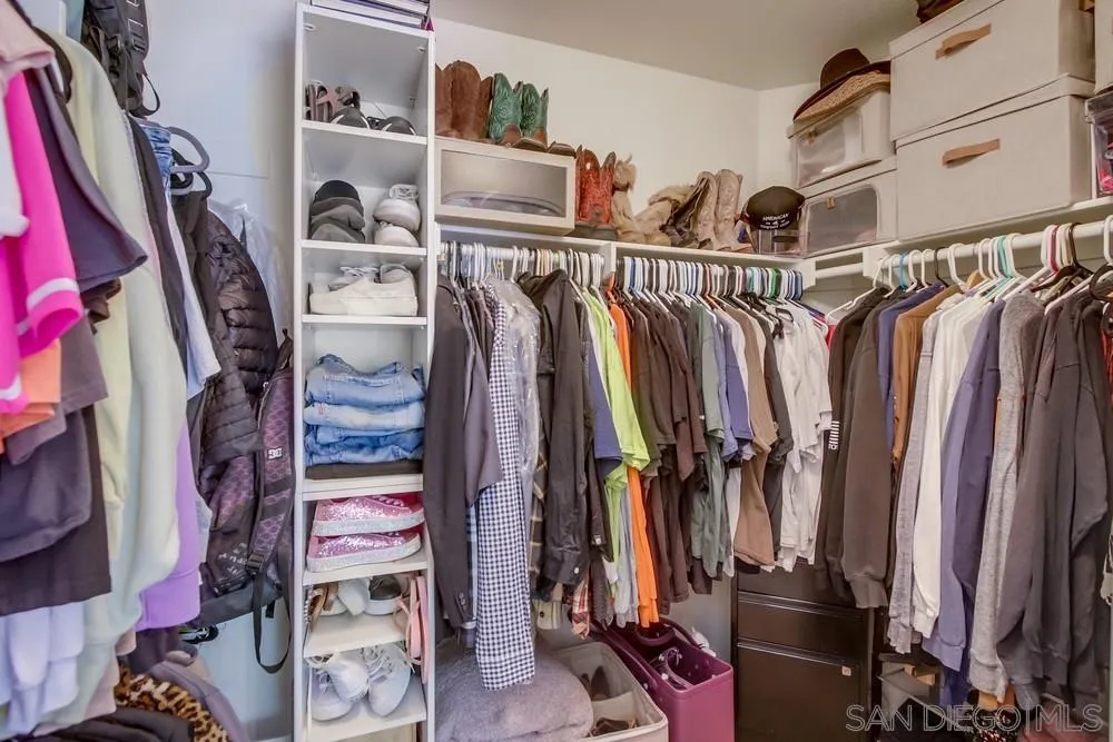 1966 Verbena Terrace Alpine, CA 91901 - Photo 25 of 41 a view of walk in closet with clothes and shoes