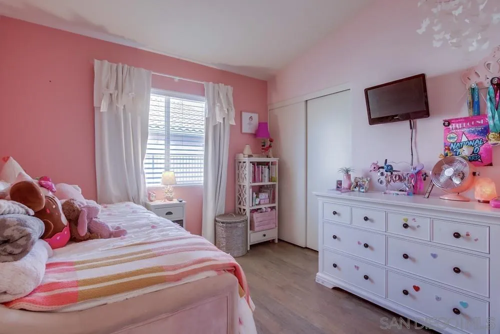 1966 Verbena Terrace Alpine, CA 91901 - Photo 27 of 41 a bedroom with a bed and flat screen tv