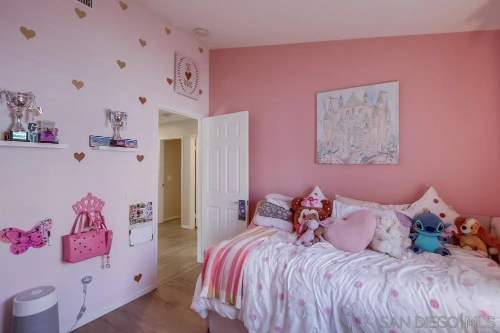 1966 Verbena Terrace Alpine, CA 91901 - Photo 28 of 41 a bed room with a bed and a couch