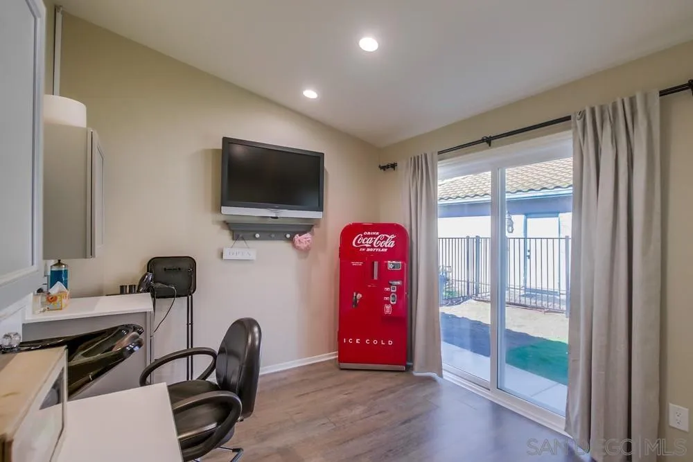 1966 Verbena Terrace Alpine, CA 91901 - Photo 30 of 41 a bedroom with furniture and a flat screen tv