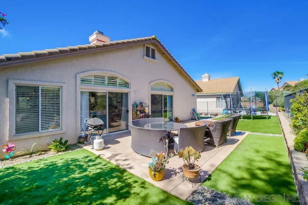 1966 Verbena Terrace Alpine, CA 91901 - Photo 34 of 41 a view of a house with backyard sitting area and garden