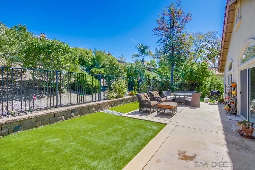 1966 Verbena Terrace Alpine, CA 91901 - Photo 36 of 41 a view of a patio with dining table and chairs with a fire pit
