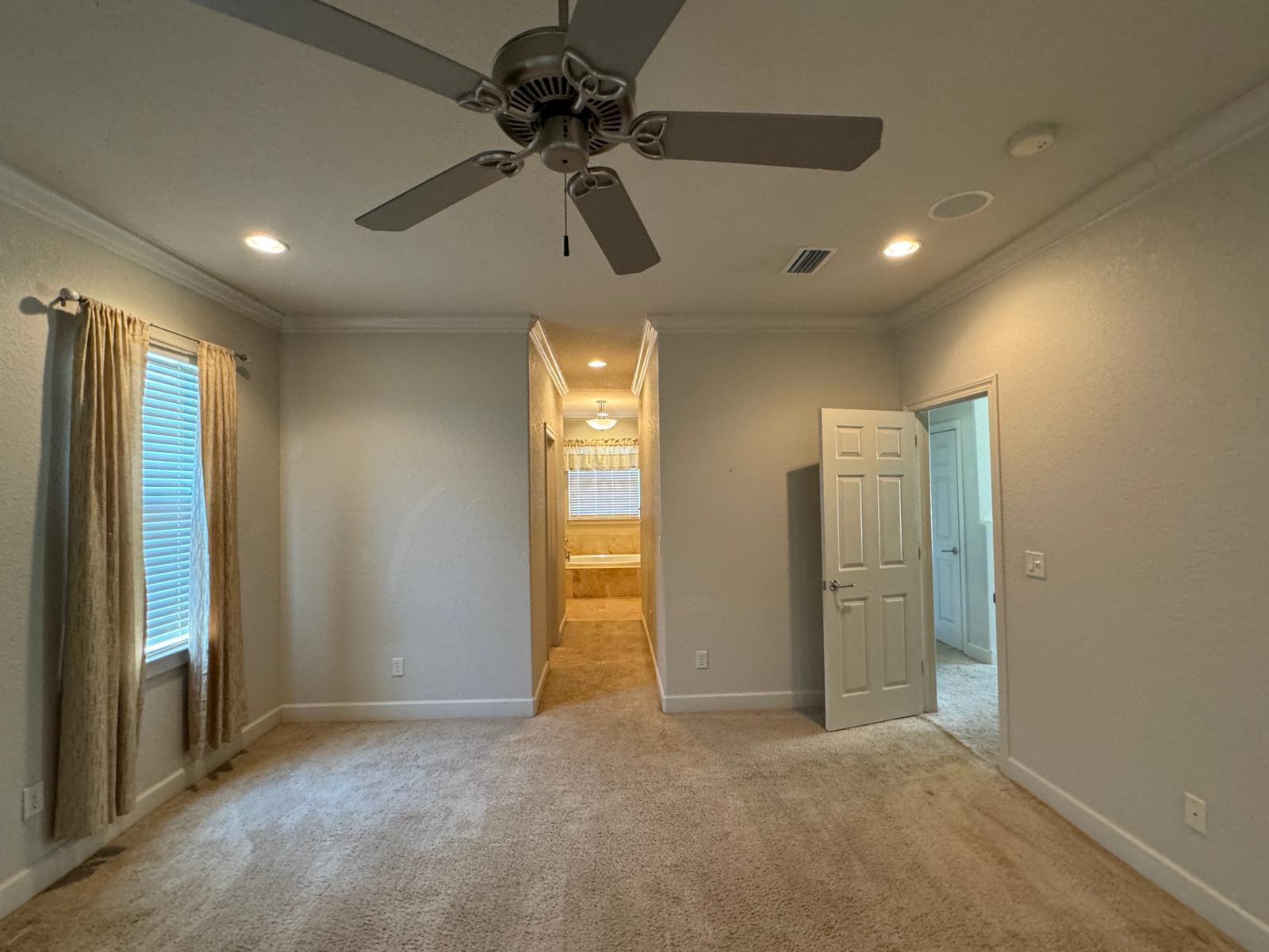241 Inverrary Drive Destin, FL 32541 - Photo 12 of 24 an empty room with closet and windows