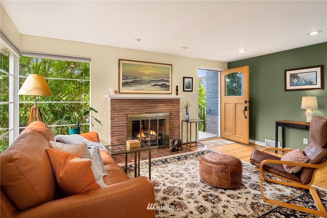 2315 North 57th Street Seattle, WA 98103 - Photo 21 of 35 a living room with furniture a fireplace and a window