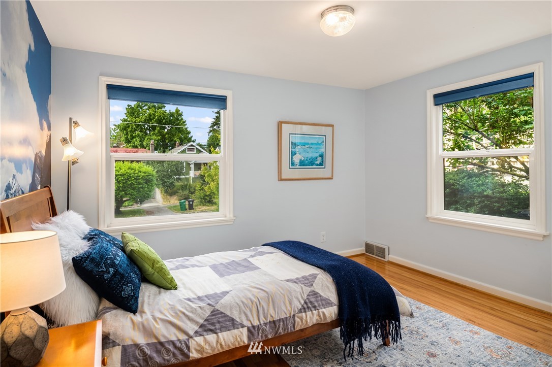 2315 North 57th Street Seattle, WA 98103 - Photo 23 of 35 a bedroom with a bed and a window
