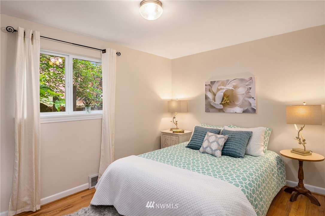 2315 North 57th Street Seattle, WA 98103 - Photo 24 of 35 a bedroom with a bed and a window