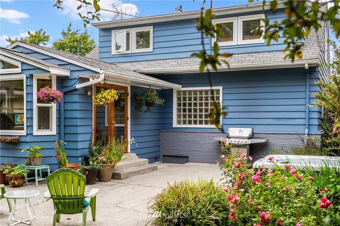 2315 North 57th Street Seattle, WA 98103 - Photo 6 of 35 a front view of a house with a yard