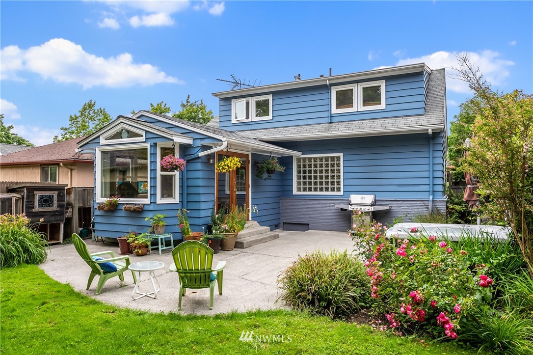 2315 North 57th Street Seattle, WA 98103 - Photo 7 of 35 a front view of a house with garden and patio