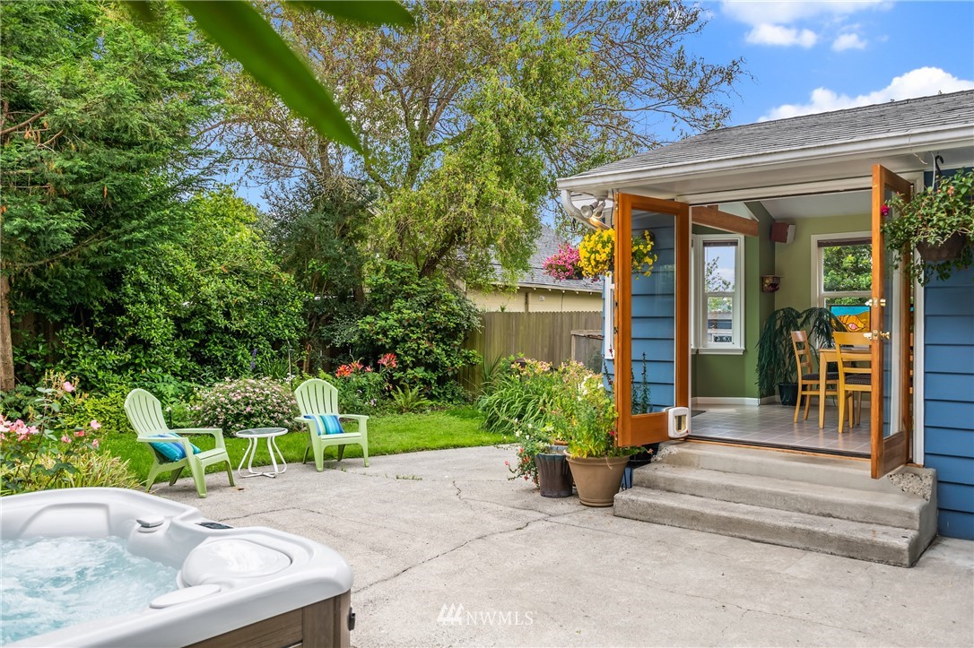 2315 North 57th Street Seattle, WA 98103 - Photo 9 of 35 a view of a house with potted plants and a fountain