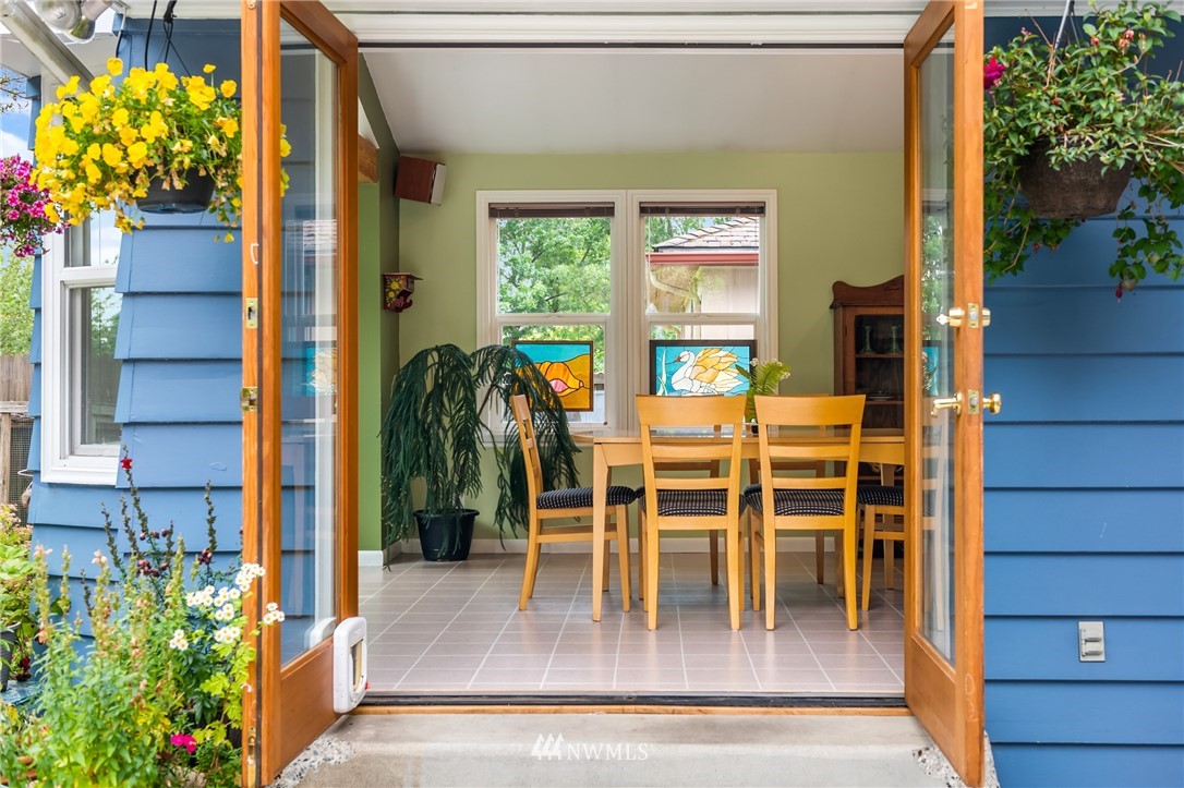 2315 North 57th Street Seattle, WA 98103 - Photo 10 of 35 a dining room with furniture and wooden floor