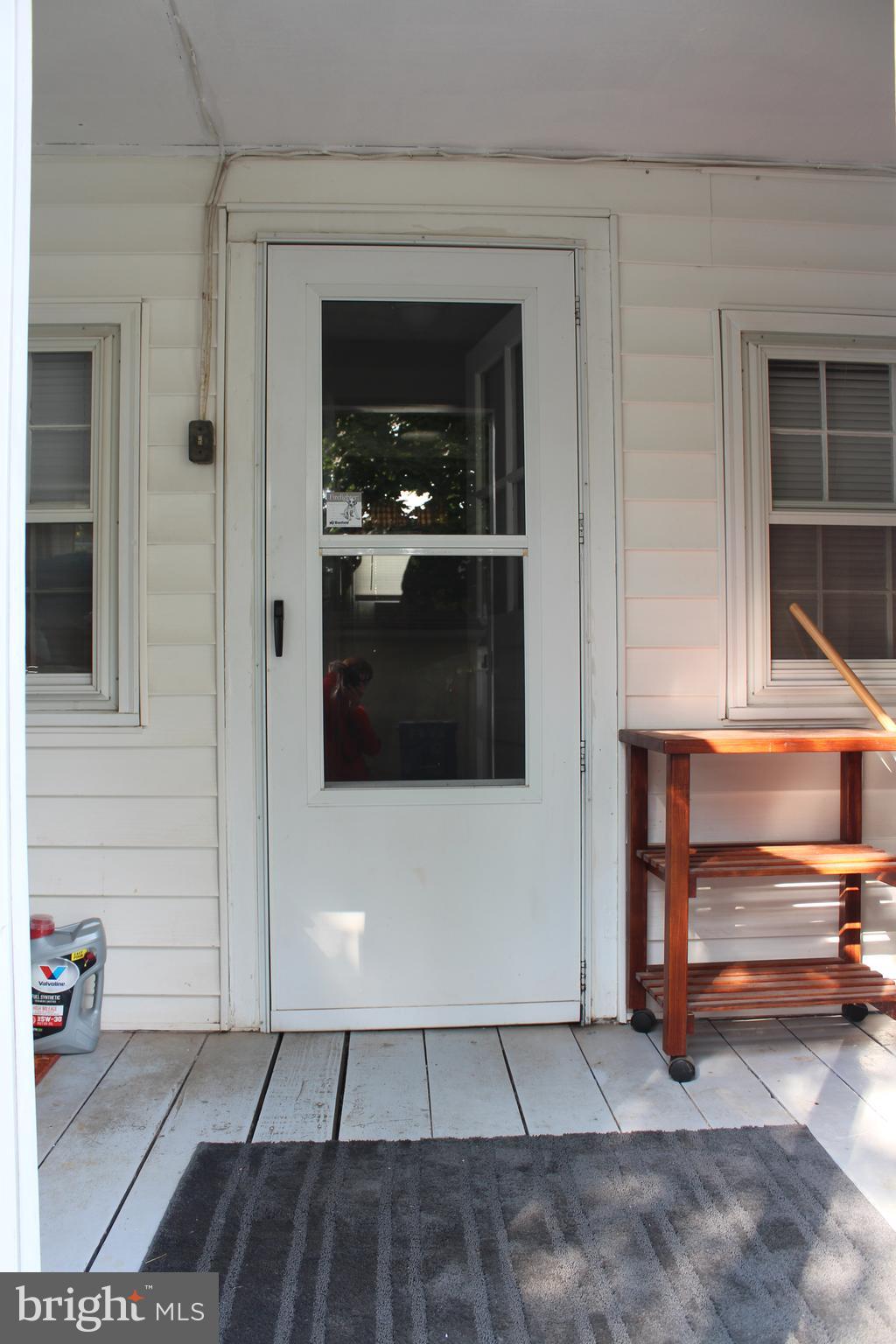 105 Rice Street Berryville, VA 22611 - Photo 21 of 24 View inside of enclosed porch to side door