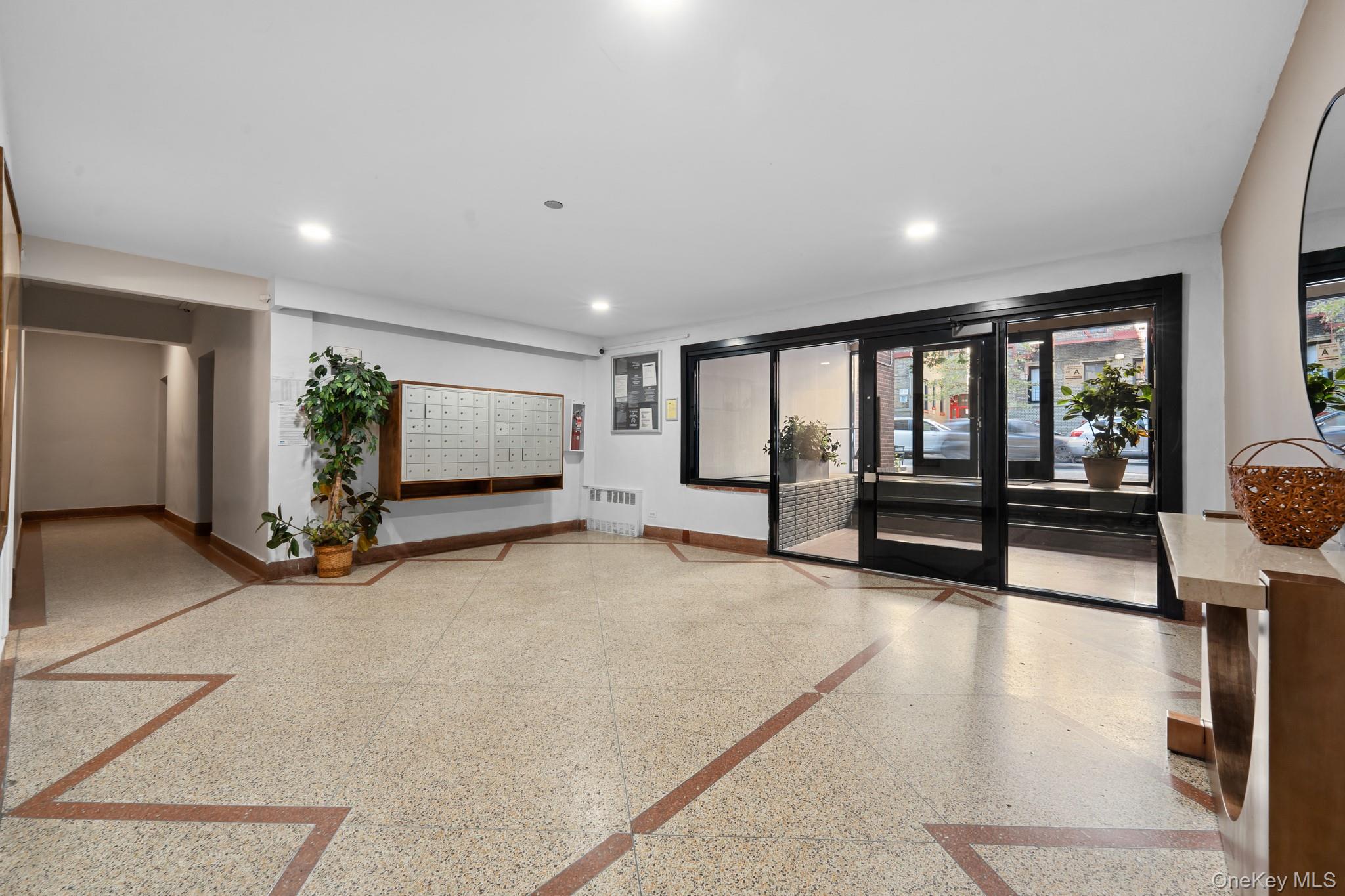 2830 Briggs Avenue, Unit 4F Bronx, NY 10458 - Photo 11 of 16 Building lobby with recessed lighting