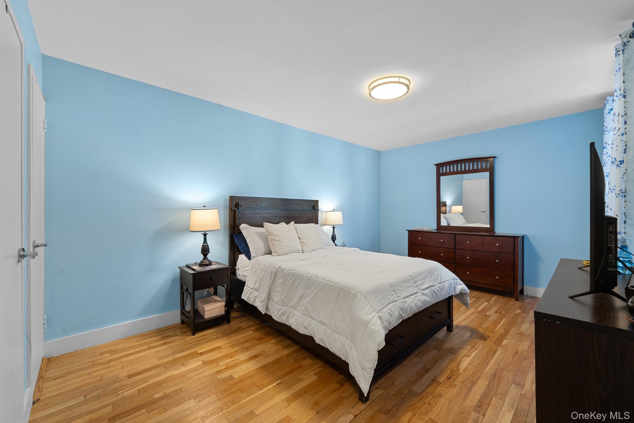 2830 Briggs Avenue, Unit 4F Bronx, NY 10458 - Photo 9 of 16 Bedroom featuring light wood finished floors