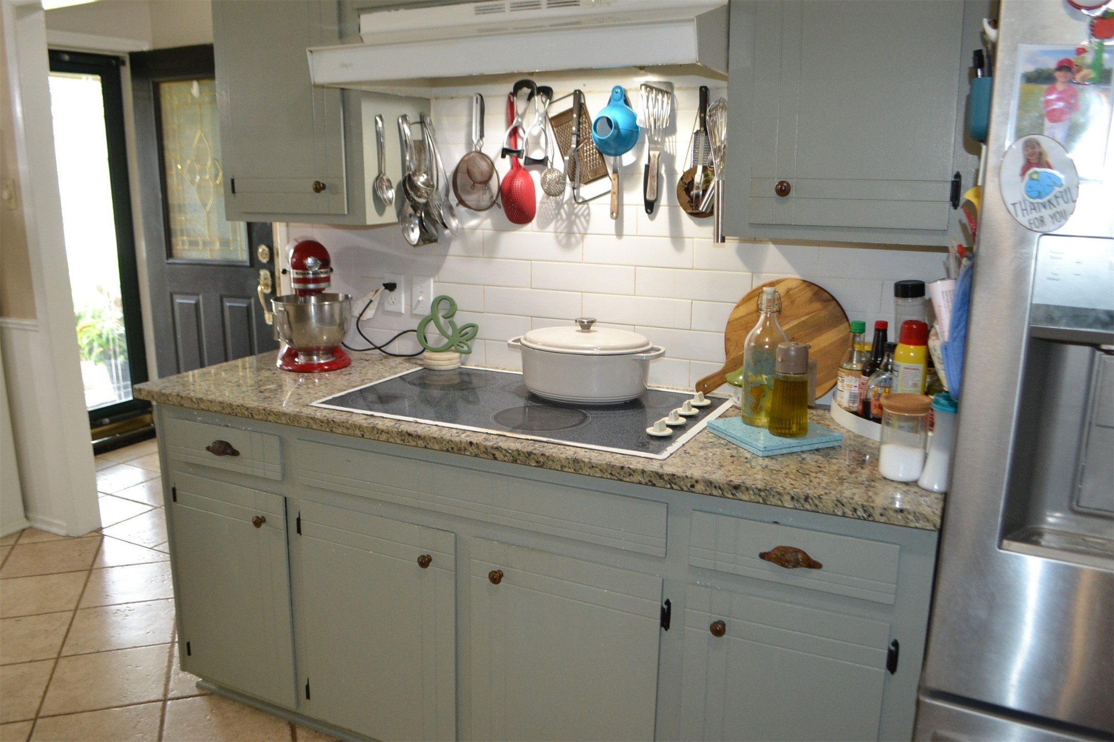610 East X Street Deer Park, TX 77536 - Photo 11 of 44 a kitchen with a sink and a refrigerator