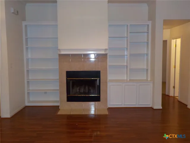 a view of a livingroom with wooden floor