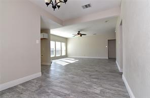 321 South Chestnut Street Forney, TX 75126 - Photo 14 of 27 an empty room with chandelier fan and windows