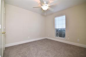 321 South Chestnut Street Forney, TX 75126 - Photo 20 of 27 an empty room with a window and a fan