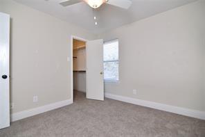 321 South Chestnut Street Forney, TX 75126 - Photo 25 of 27 an empty room with an entryway and wooden floor