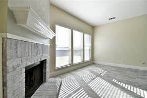 321 South Chestnut Street Forney, TX 75126 - Photo 5 of 27 a view of a livingroom with a fireplace and window