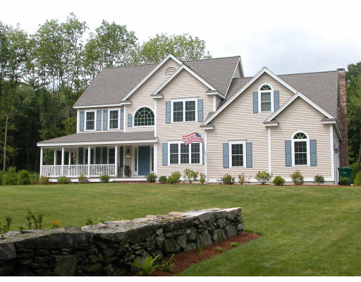 269 Sargent Road Boxborough, MA 01719 - Photo 1 of 1 a front view of a house with a garden and trees