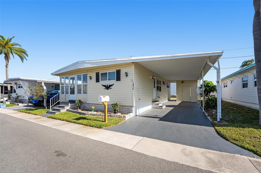 a view of a house with outdoor space and porch