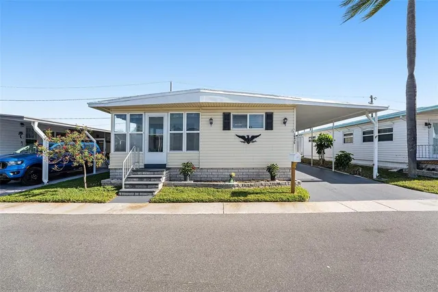 a view of house with outdoor space and porch