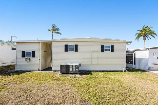 a view of a house with snow in the background