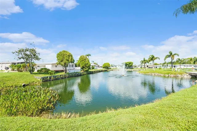 a view of a lake with a house in the background
