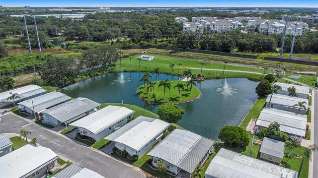 an aerial view of a swimming pool patio and outdoor seating