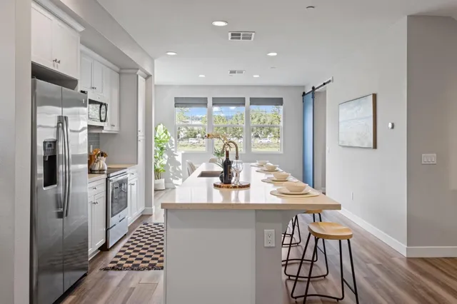 a very nice looking dining room with a large window
