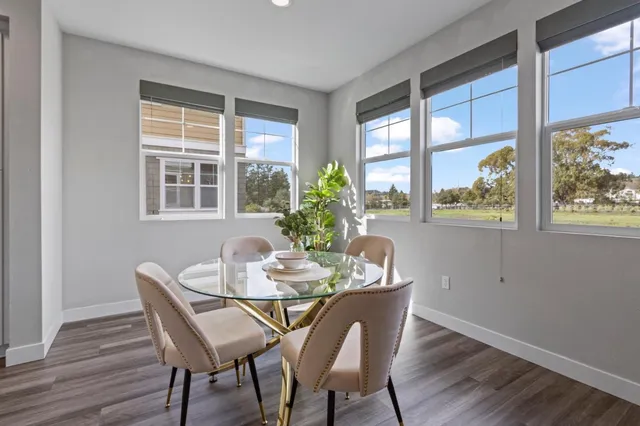 a dining room with furniture window wooden floor