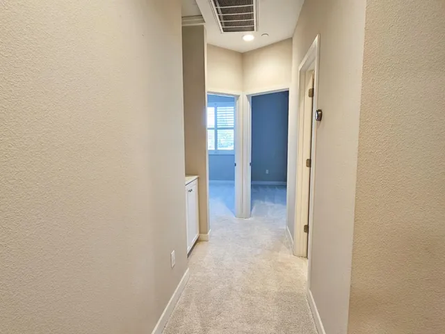 an empty room with closet area