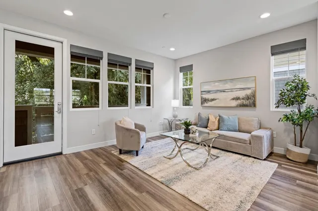 a living room with furniture and windows