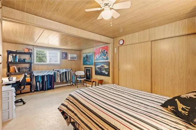 a bedroom with furniture and a chandelier
