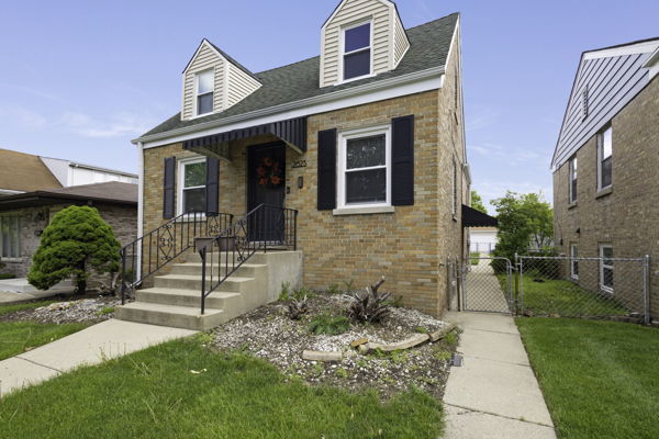 2623 North Rhodes Avenue River Grove, IL 60171 - Photo 17 of 17 a front view of a house with garden
