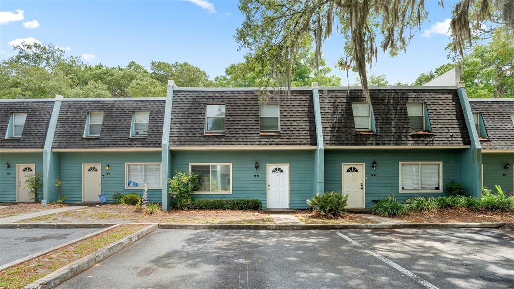 501 Southwest 75th Street, Unit B5 Gainesville, FL 32607 - Photo 2 of 38 a front view of a house with a garden