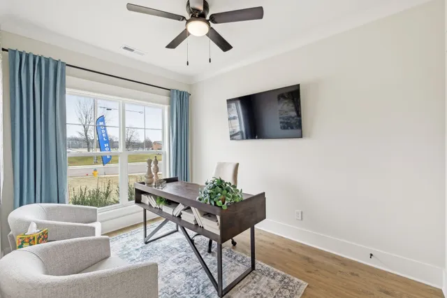 a living room with furniture and a window